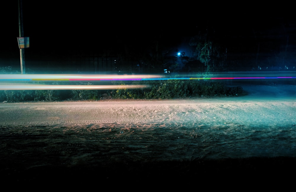 a blurry photo of a street at night