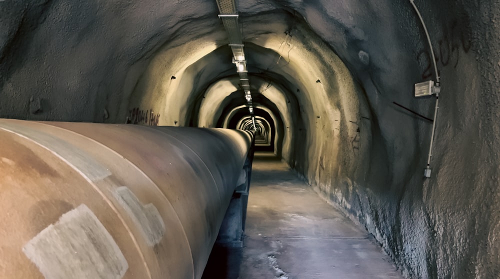 a tunnel with a long pipe going through it