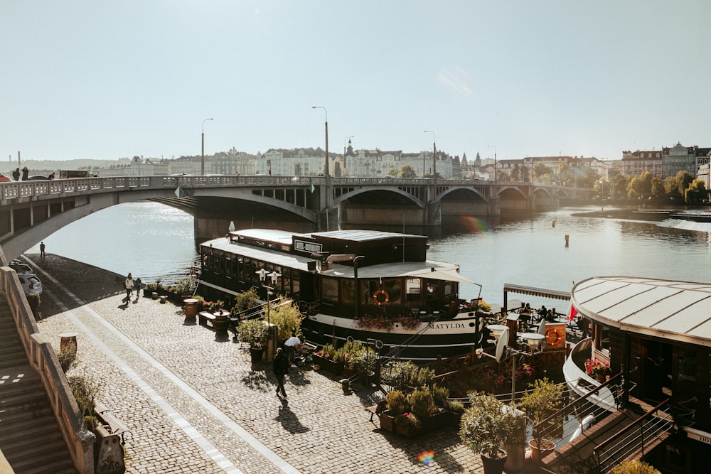 a river with a bridge in the background