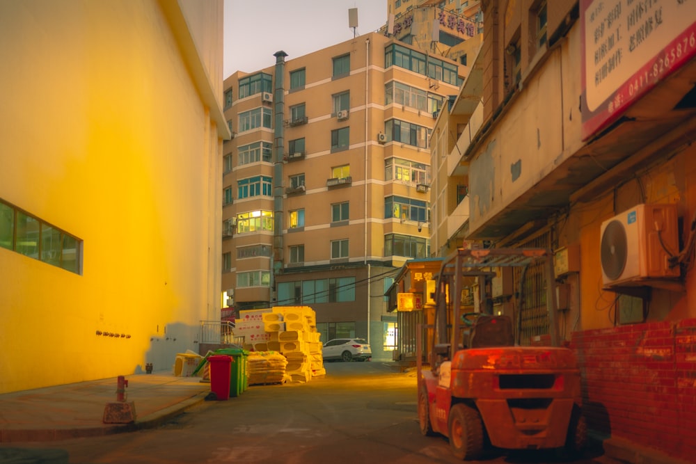 a city street filled with lots of traffic next to tall buildings