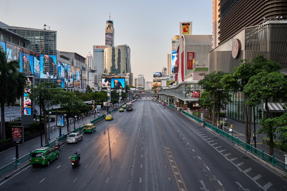 a city street with cars driving down it