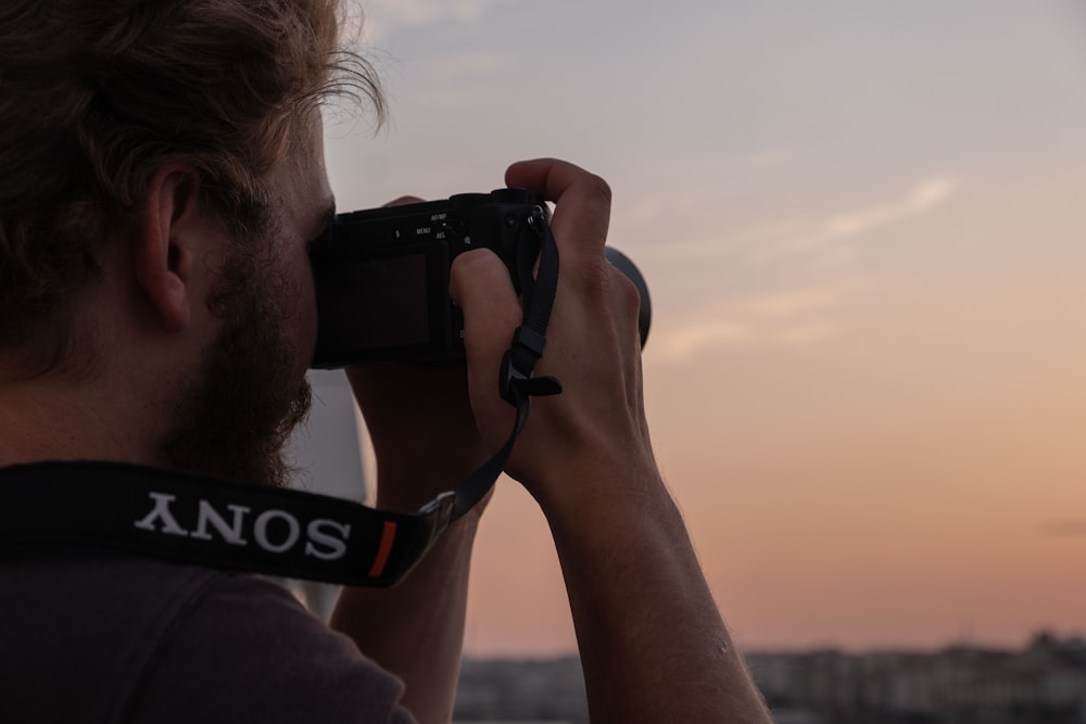 a man taking a picture with a camera