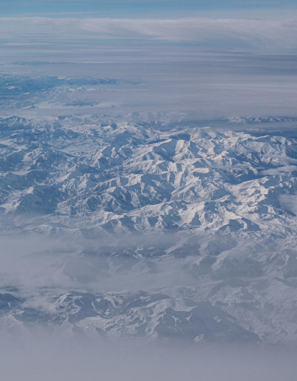 a view of a mountain range from an airplane