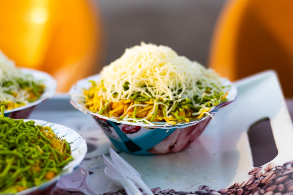 a close up of bowls of food on a tray