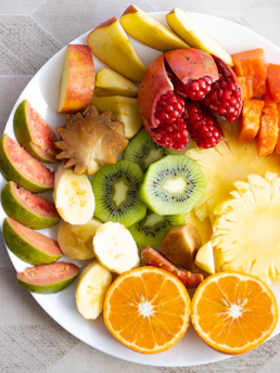 a white plate topped with cut up fruit
