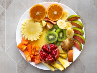 a white plate topped with cut up fruit