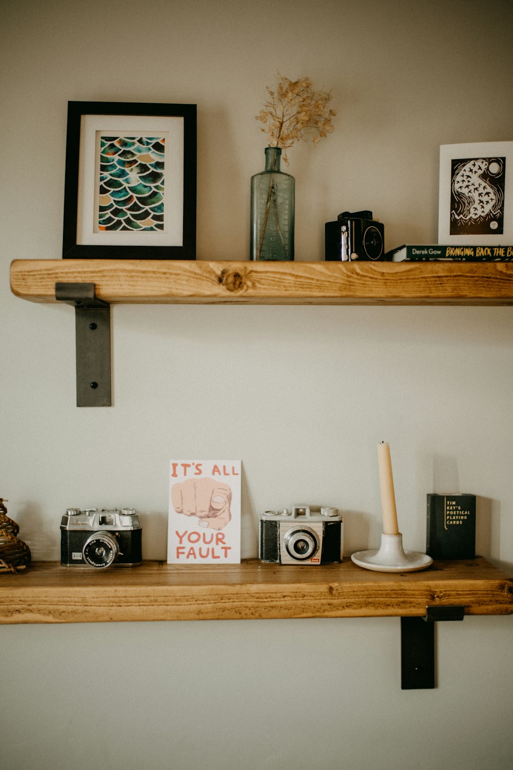 a couple of shelves that have some pictures on them