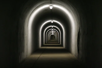a dark tunnel with light at the end
