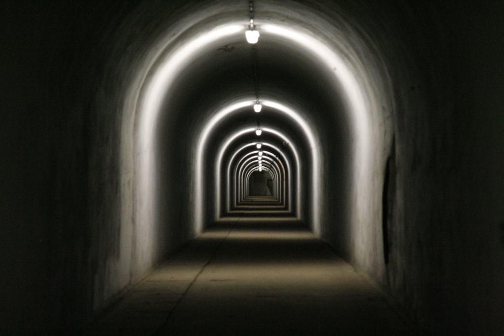 a dark tunnel with light at the end