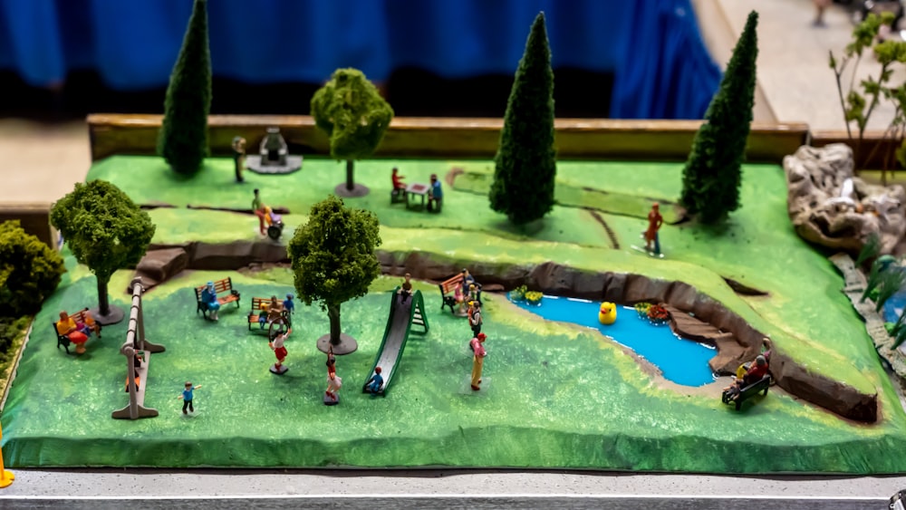 a model of a park with trees and people