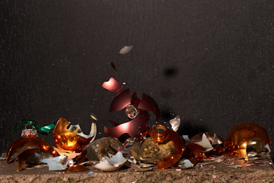 Assortment of shattered drinking glasses in various colors and shapes