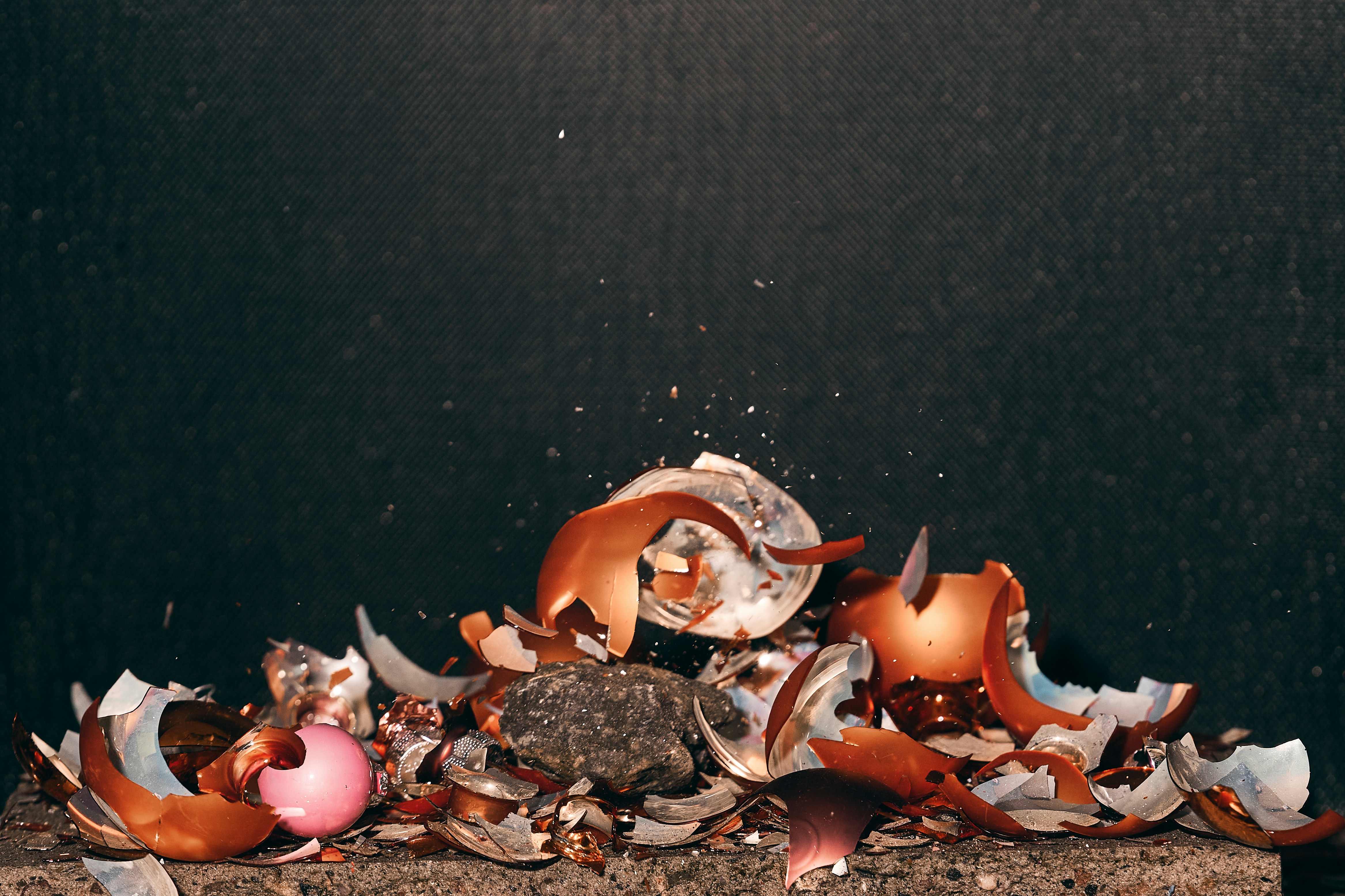 a pile of garbage sitting on top of a wooden table