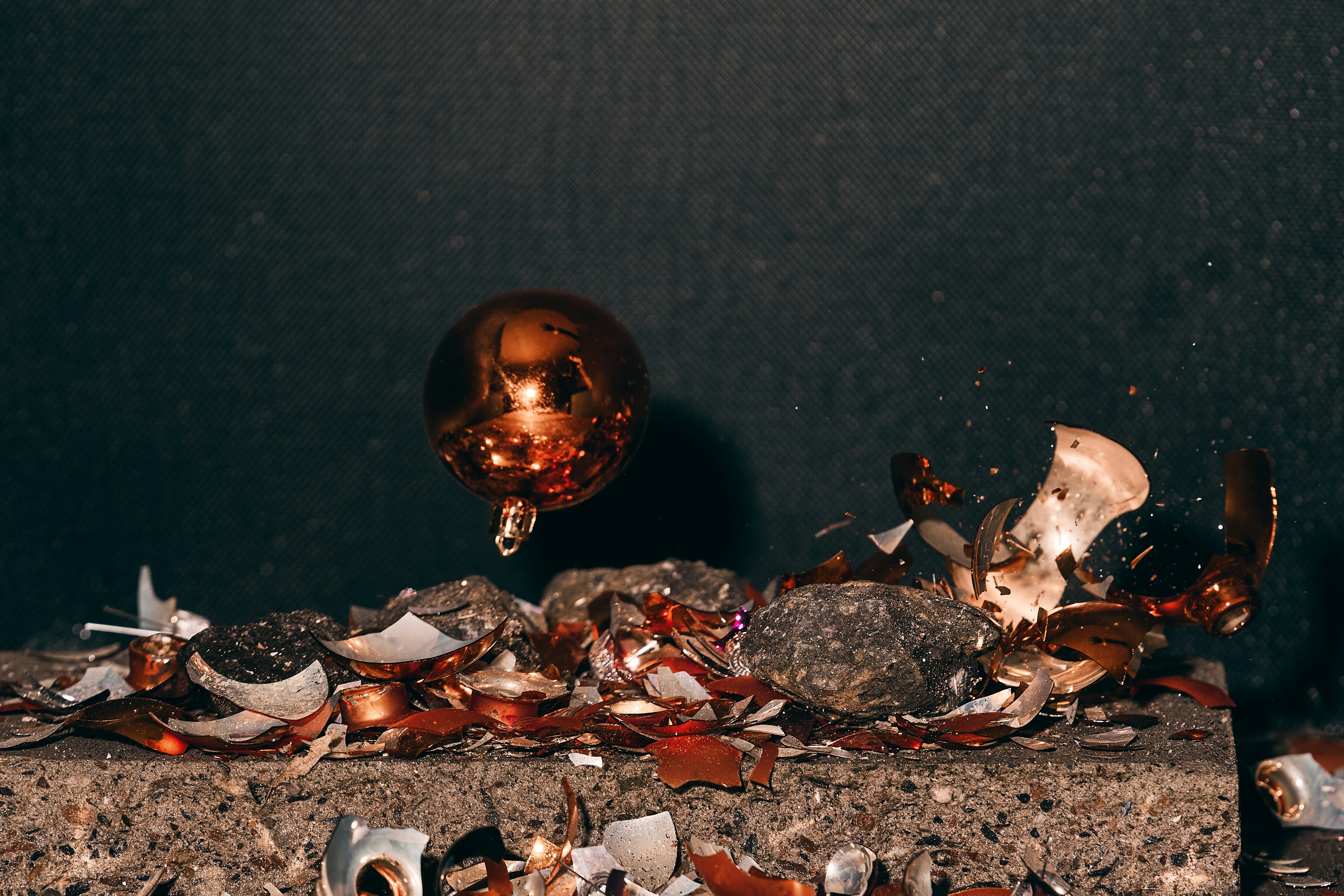 a pile of broken glass on top of a table