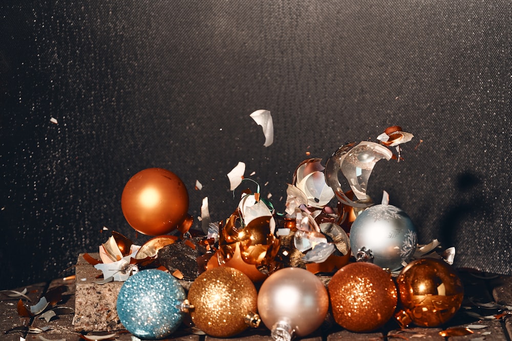 a bunch of different colored ornaments on a table