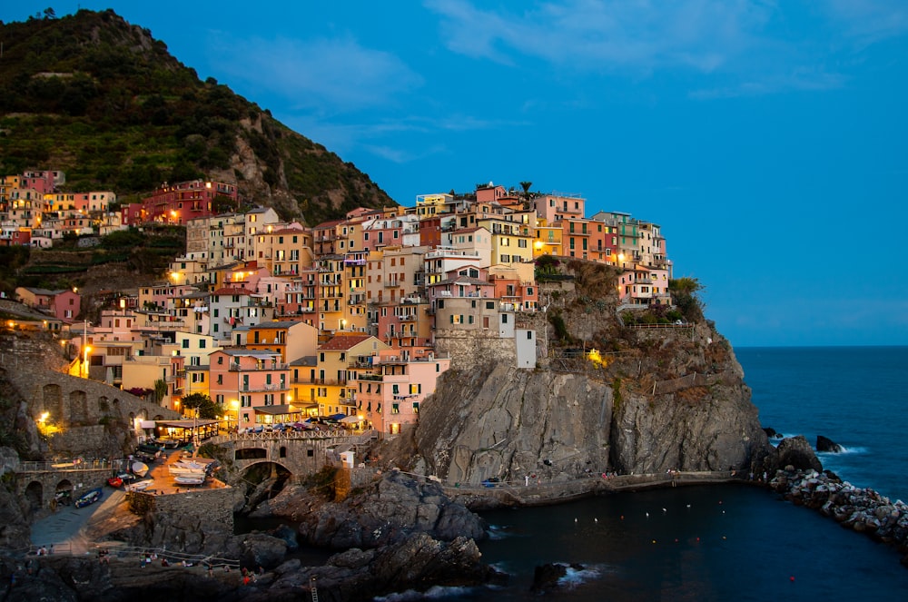 a small village on a cliff by the ocean