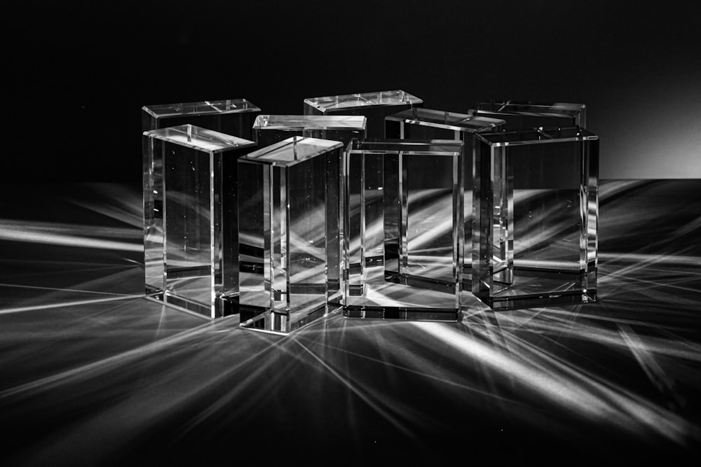 three crystal cubes sitting on top of a table