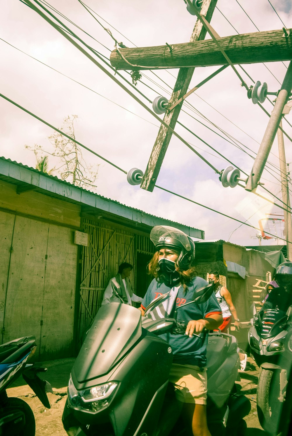 a couple of people riding on the back of a motorcycle