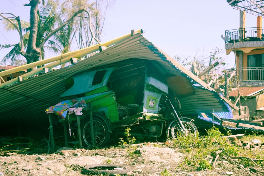 a house that has been torn down with a bike parked in front of it