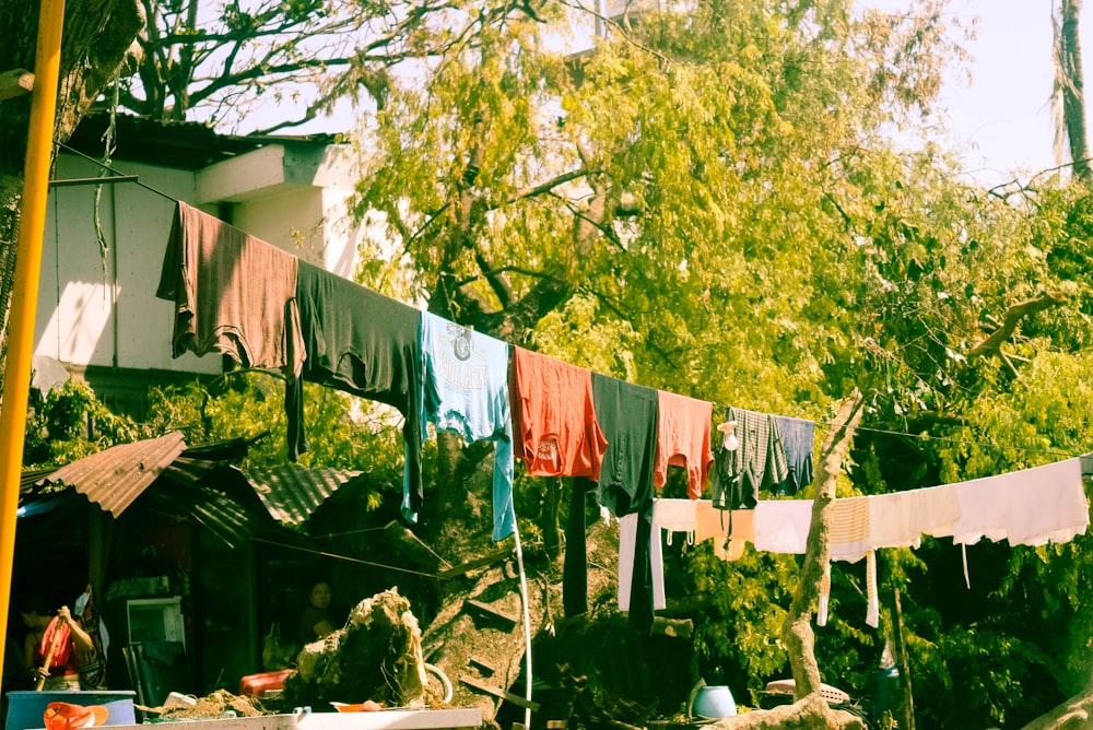 a bunch of clothes hanging on a clothes line