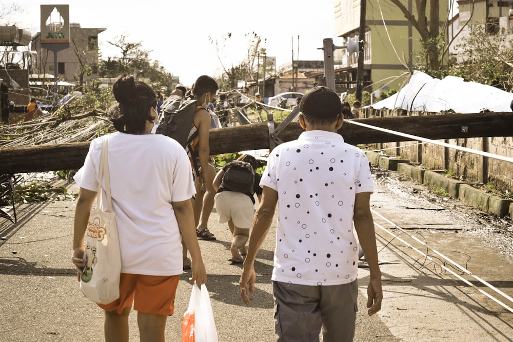 a group of people walking down a street