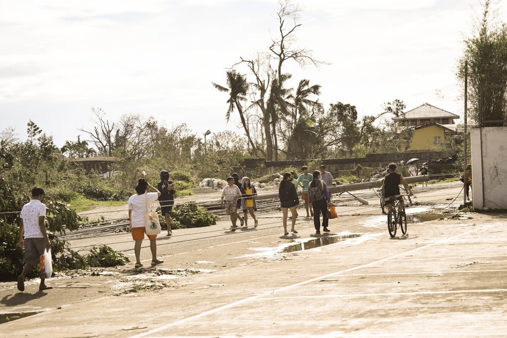 a group of people walking down a street