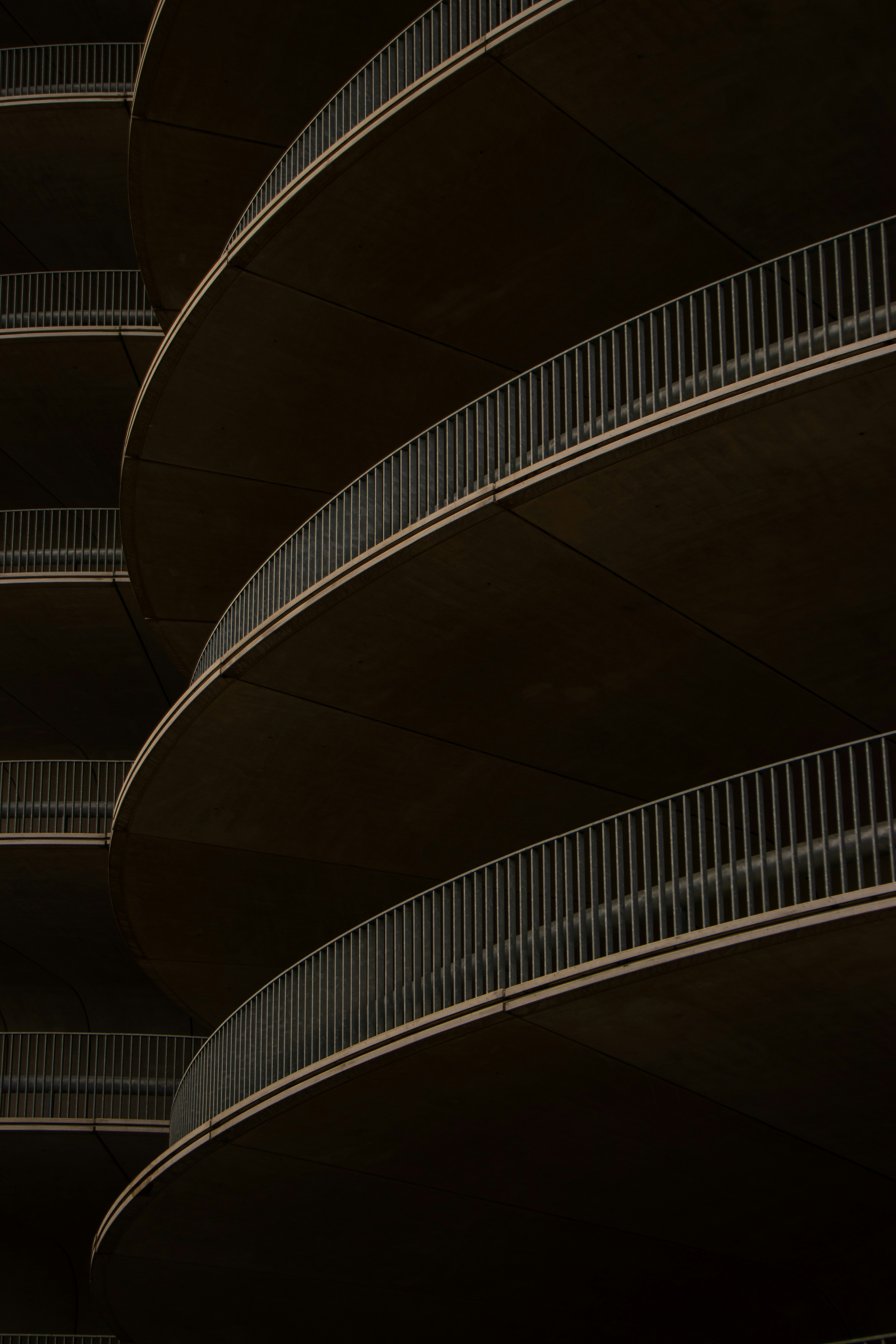 A building with balconies and a clock on the side of it