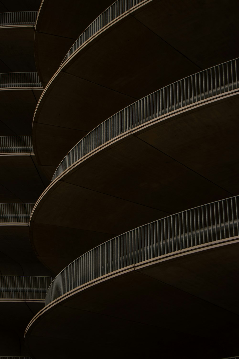 a building with balconies and a clock on the side of it