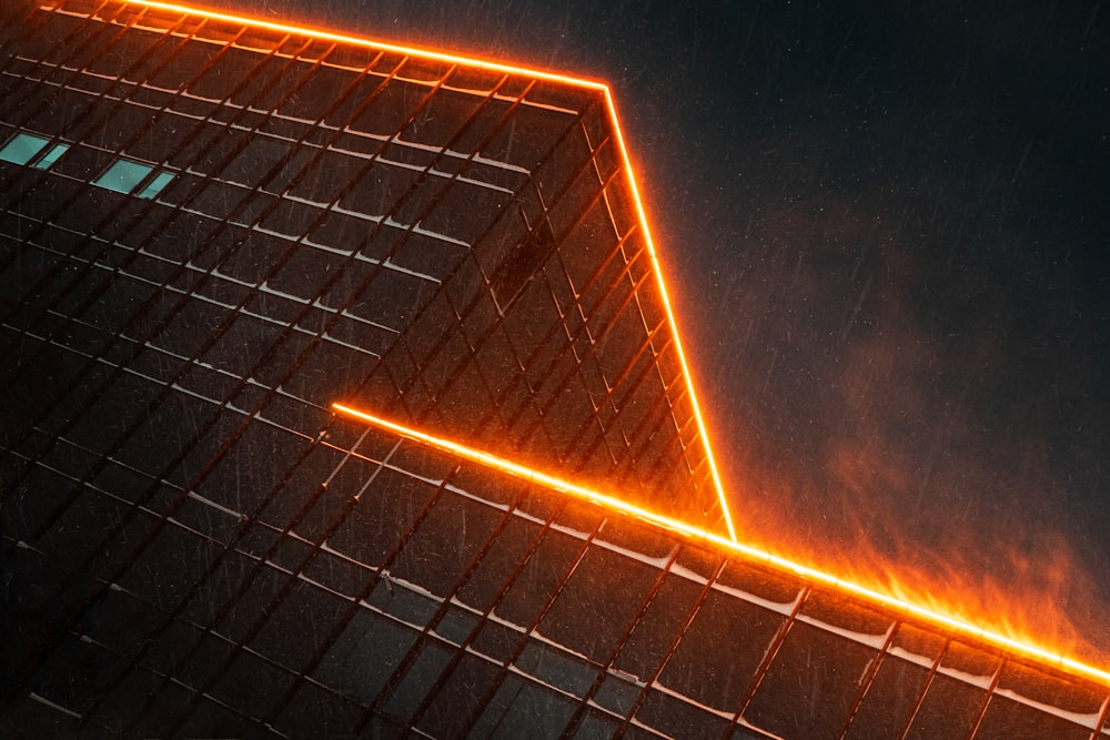 a building with a neon triangle on the side of it