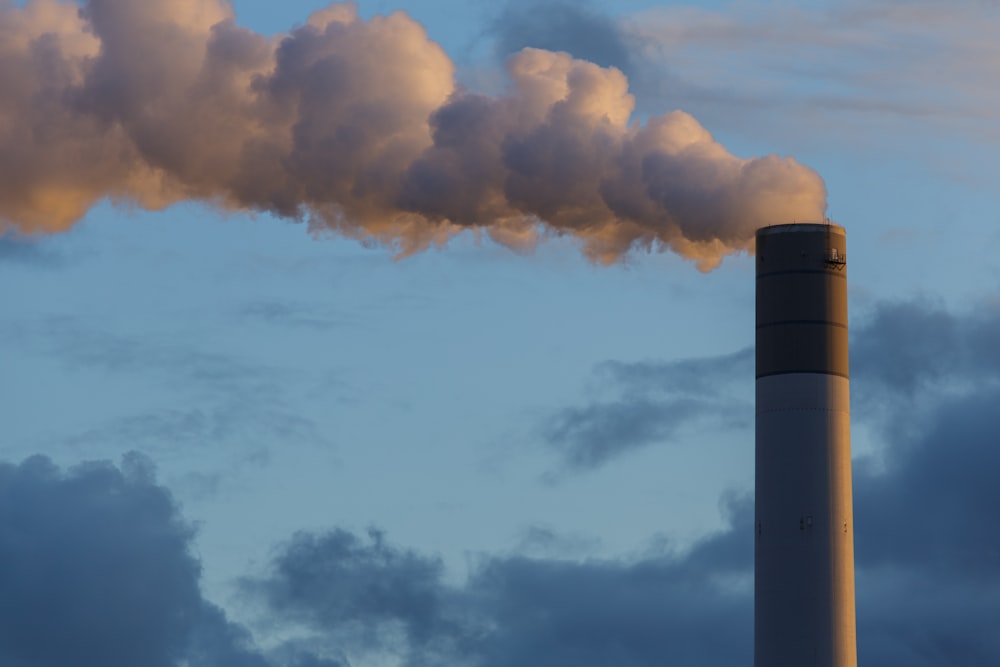 a smokestack emits from the top of a building