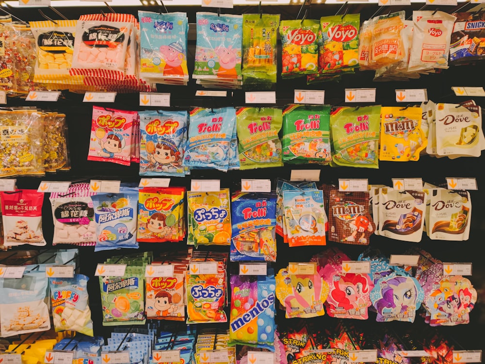 a variety of snacks are on display in a store