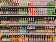 a store shelf filled with lots of bottles of beer