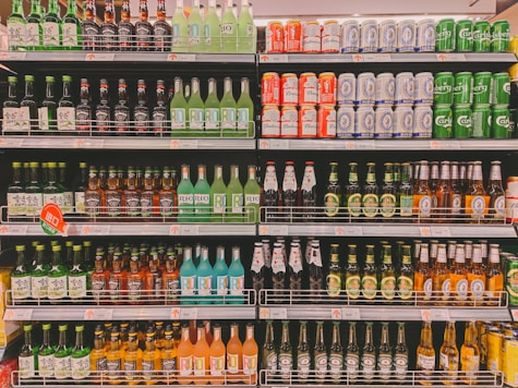 a store shelf filled with lots of bottles of beer