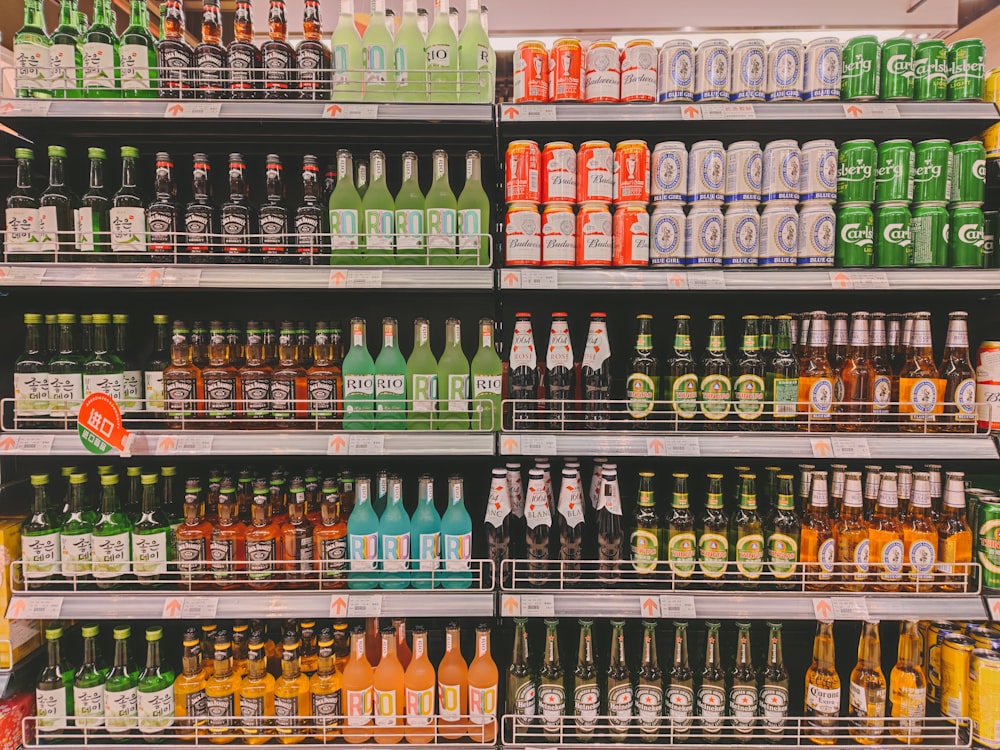 a store shelf filled with lots of bottles of beer