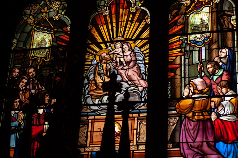 a stained glass window depicting the birth of jesus