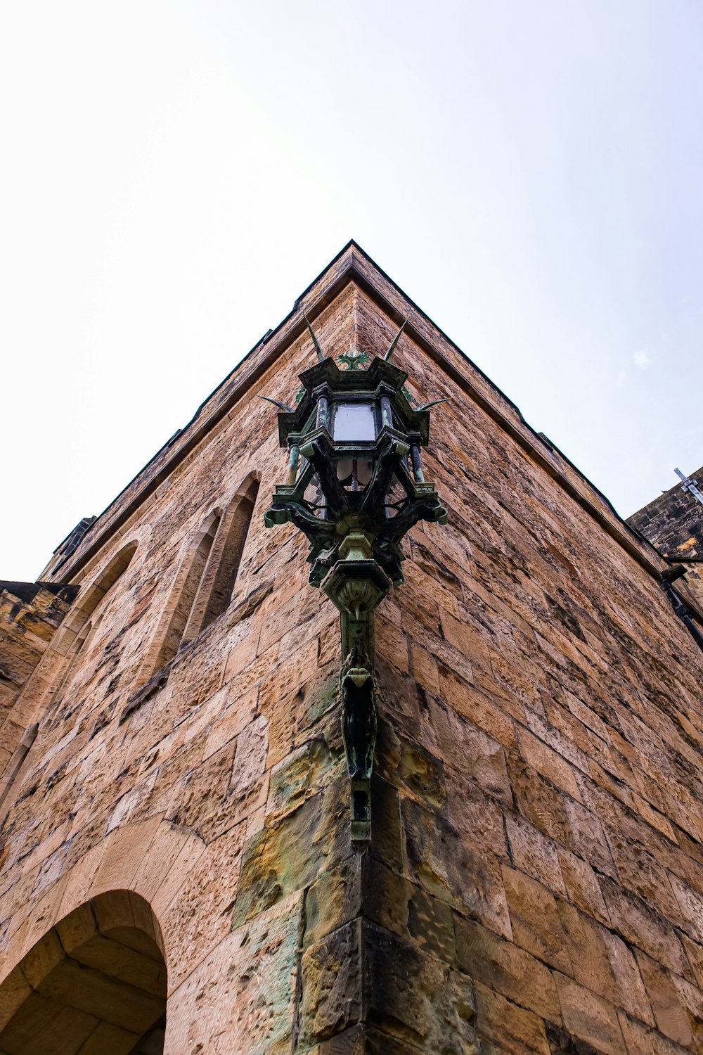 a clock on the side of a brick building