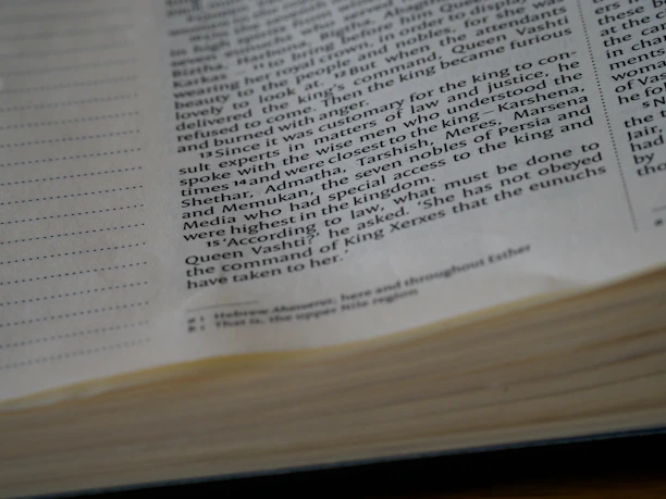 Close-up of hands flipping through pages of a printed version of the e-book.