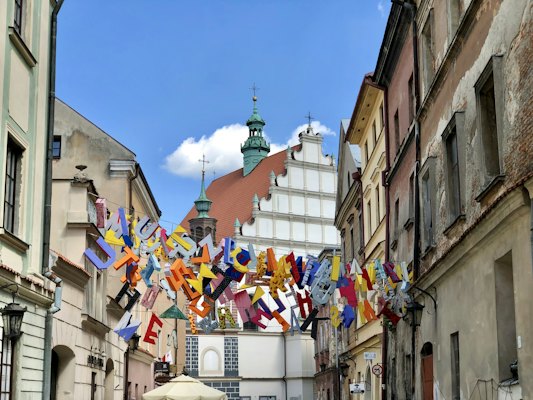 Flags across a street in the old town — Lublin, Poland