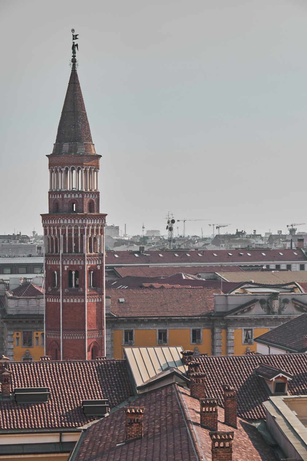 a tall clock tower towering over a city