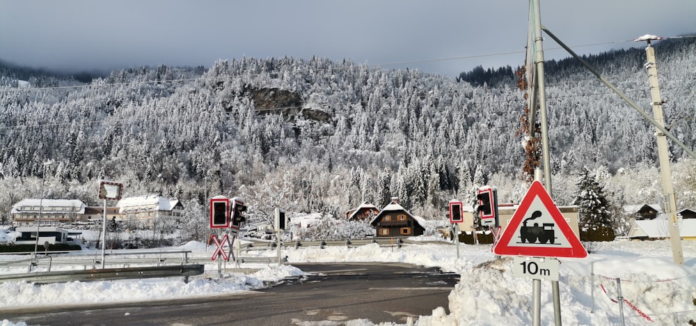 a road with snow covered mountains in the background