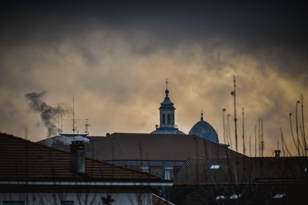 a view of a building with a clock tower in the background