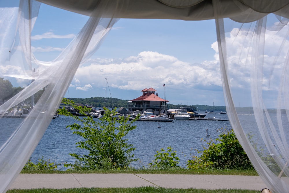 a view of a harbor with boats and a gazebo