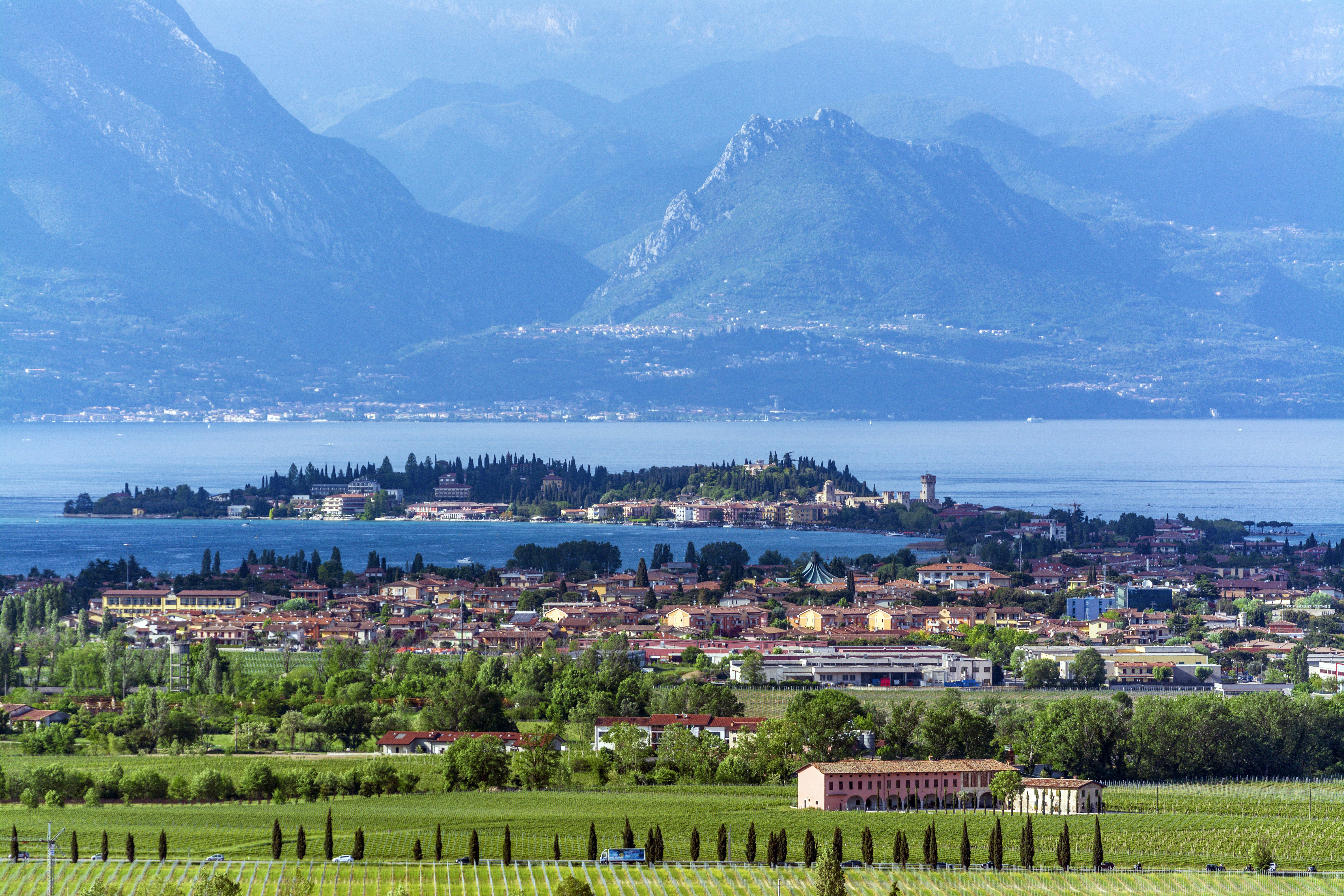 a scenic view of a small town in the mountains