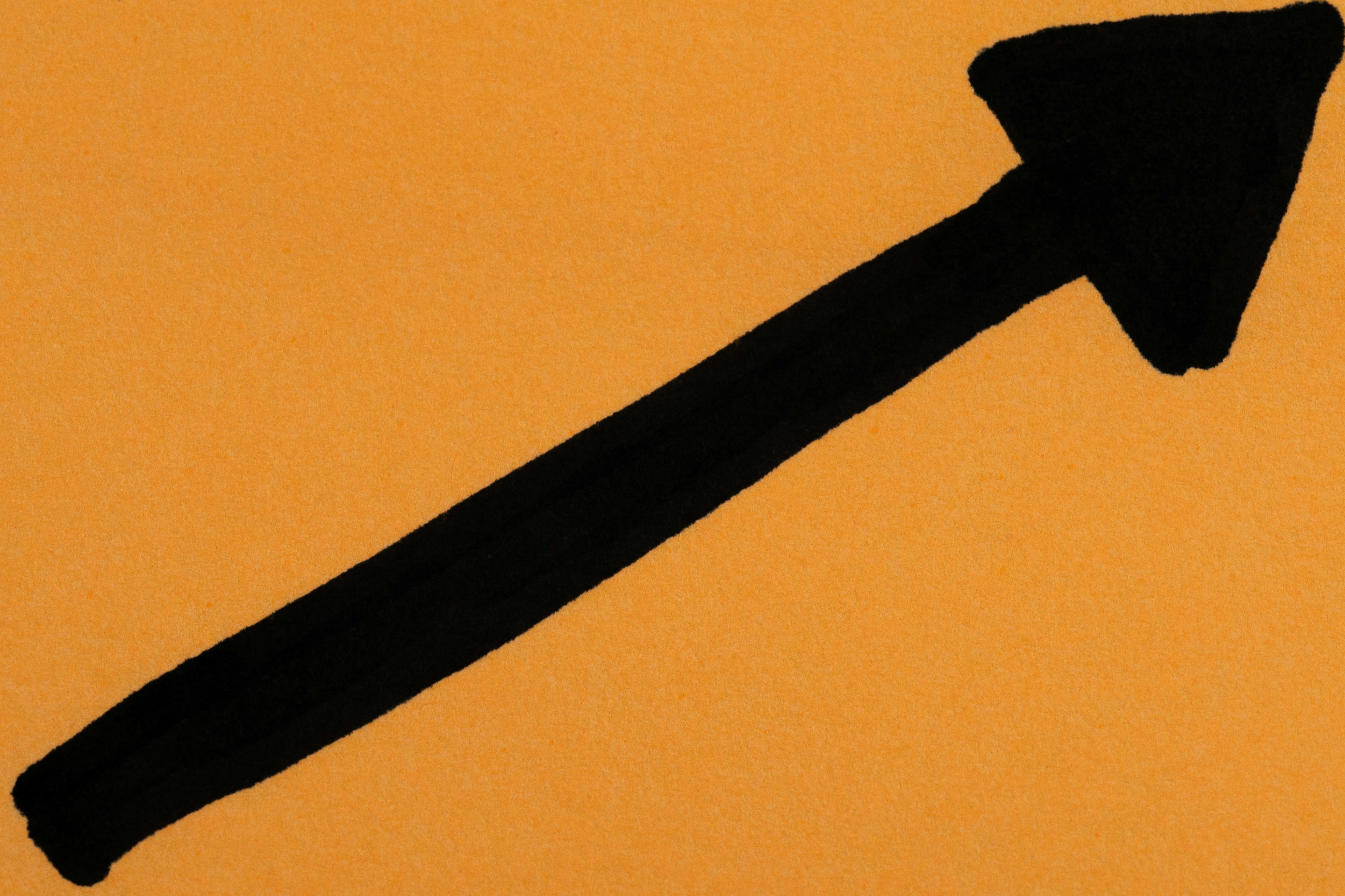 Arrow up and right on an orange background