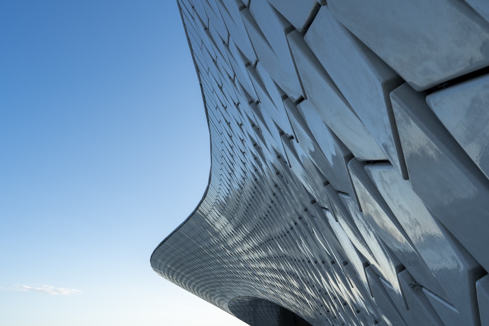 a close up of a building with a sky in the background