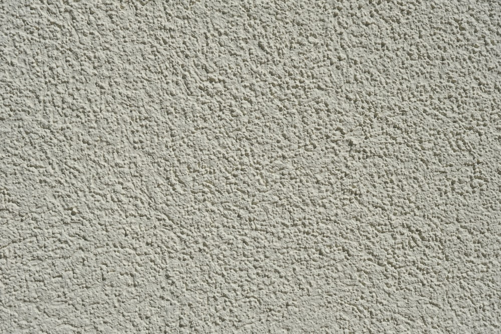 a close up of a wall made of cement