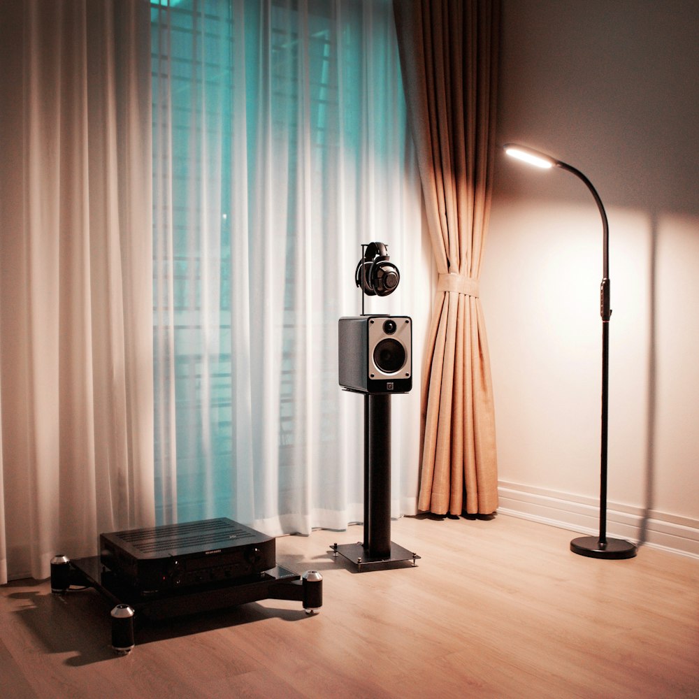 a pair of speakers sitting on top of a hard wood floor