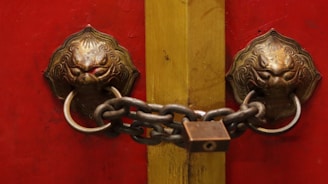 Locked door with heavy chain symbolizing wasted business energy and astrological blockages
