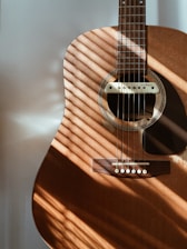 a close up of a guitar on a table