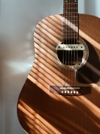 a close up of a guitar on a table