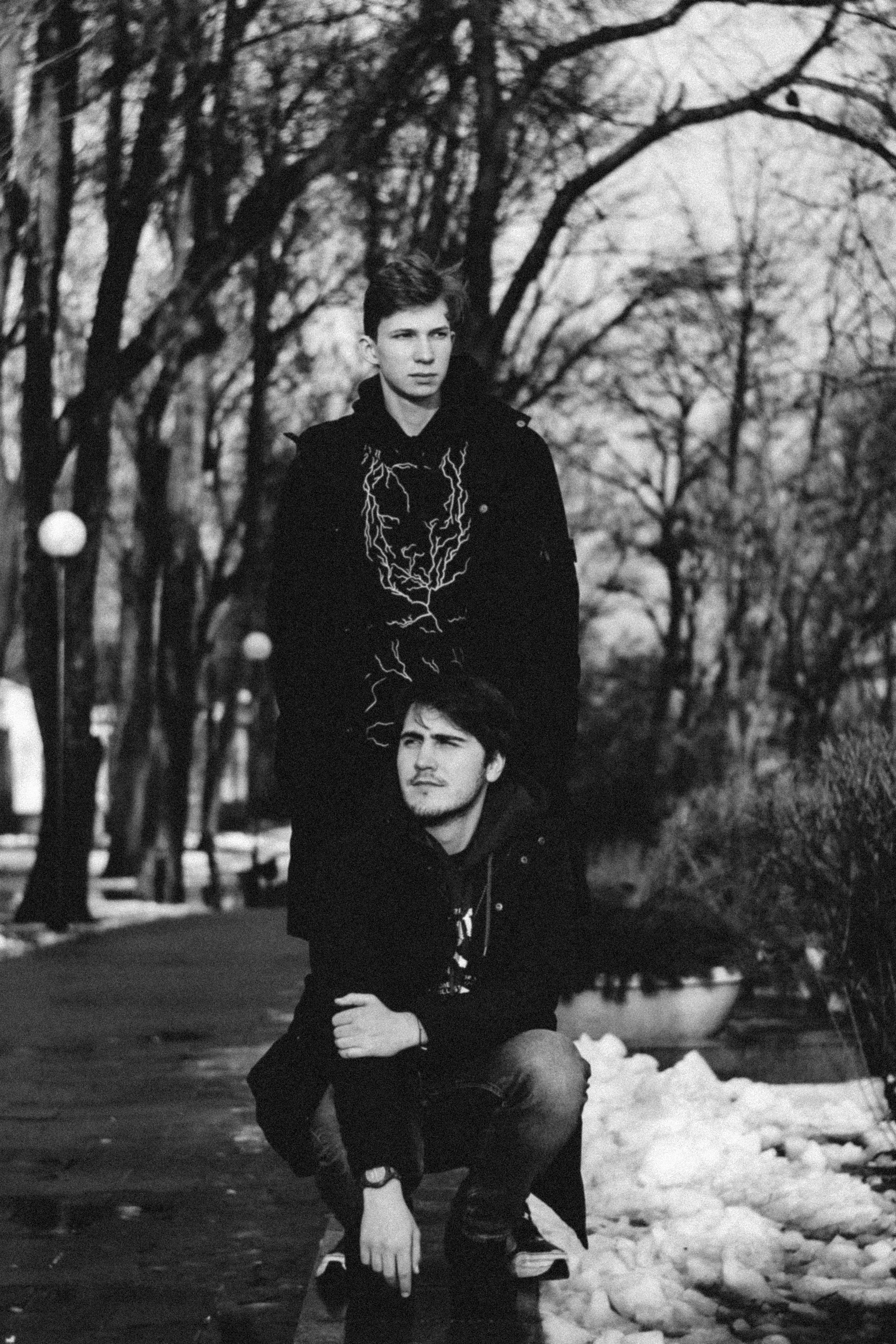 a couple of people that are standing in the snow